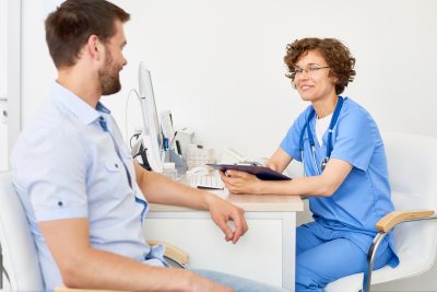 Clinician speaking with a patient